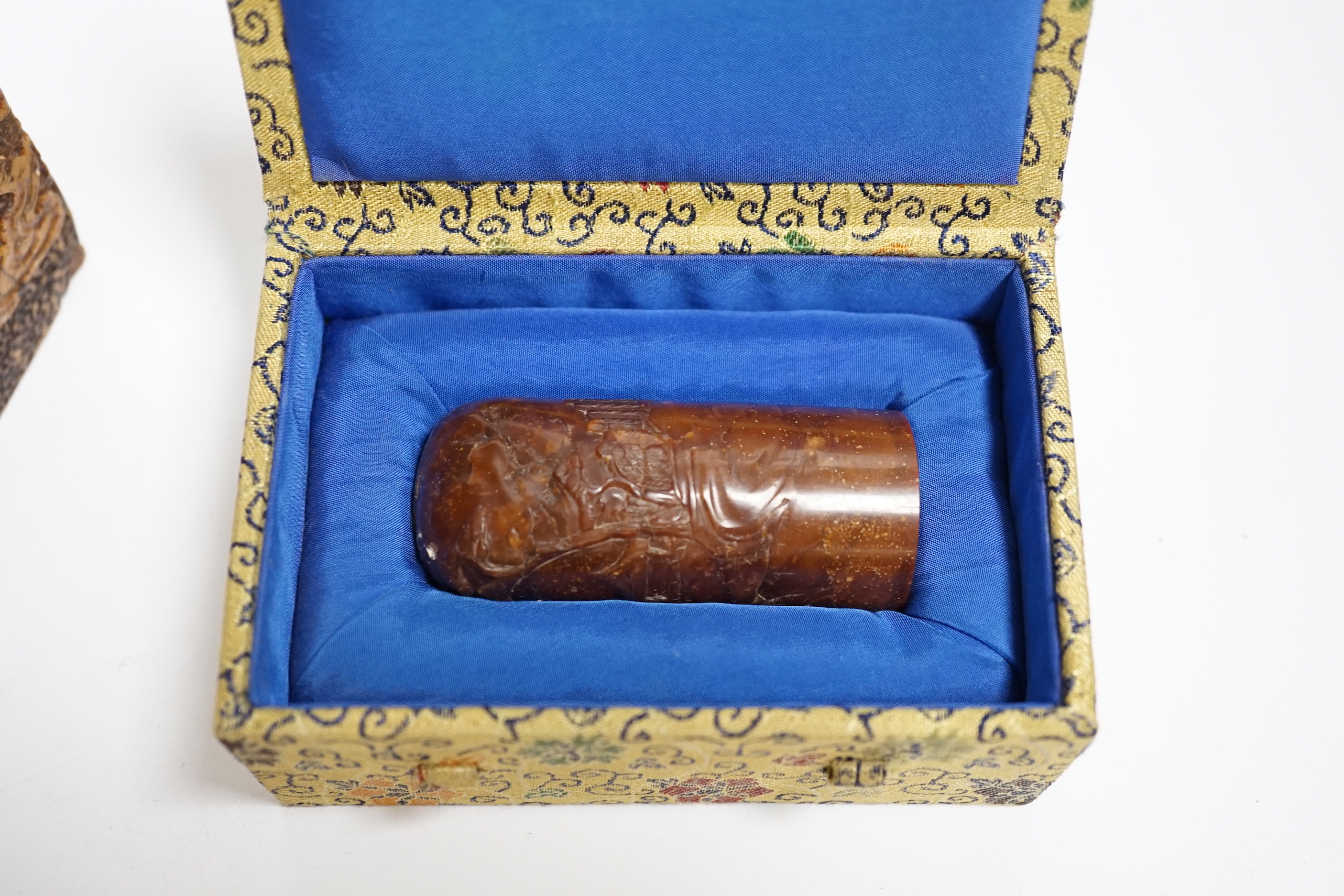 A large Chinese soapstone 'dragon' seal and a smaller seal, cased (2), tallest 20cm